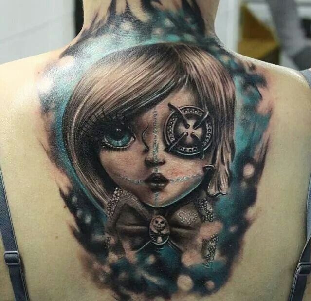 New school style colored back tattoo of fantasy woman with eye badge