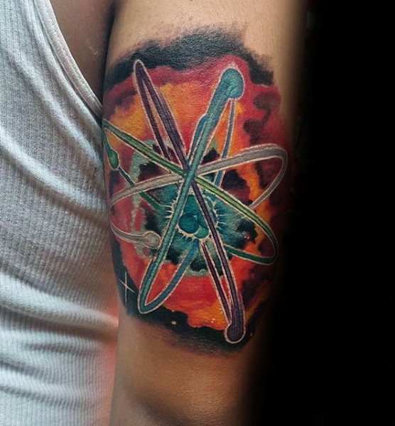 New school style colored biceps tattoo of big atom