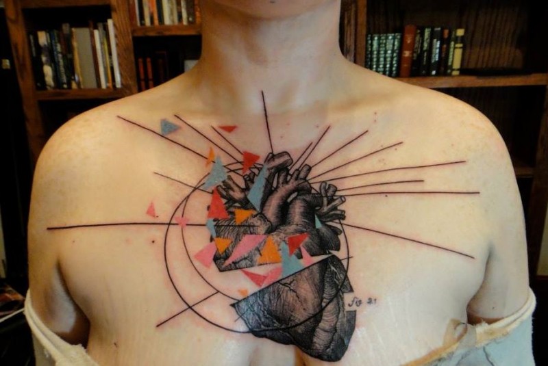 New school style colored chest tattoo of human heart with ornaments