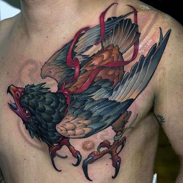 New school style colored chest tattoo of large bird with red ribbon