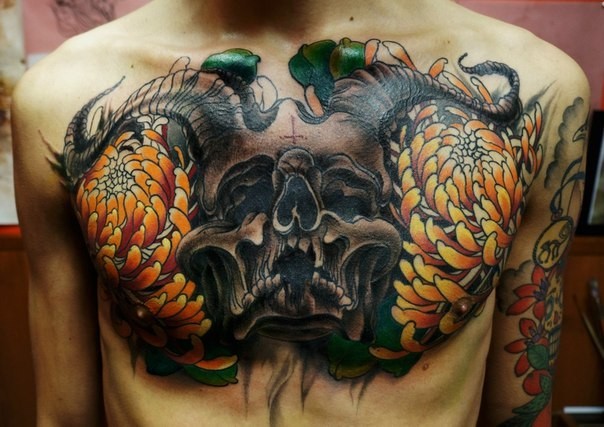 New school style colored chest tattoo of devils skull with chrysanthemum flowers