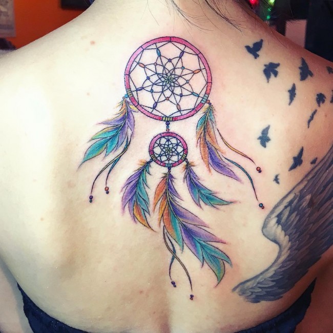 New school style colored dream catcher tattoo on back