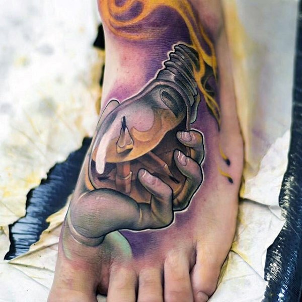 New school style colored foot tattoo of hand holding bulb with pencils
