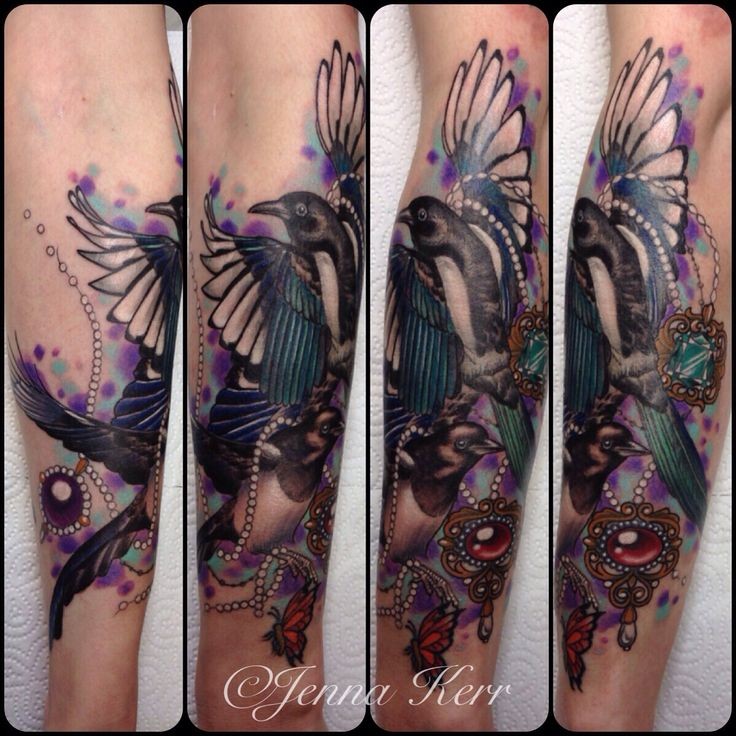 New school style colored forearm tattoo painted by Jenna Kerr of large birds with jewelry