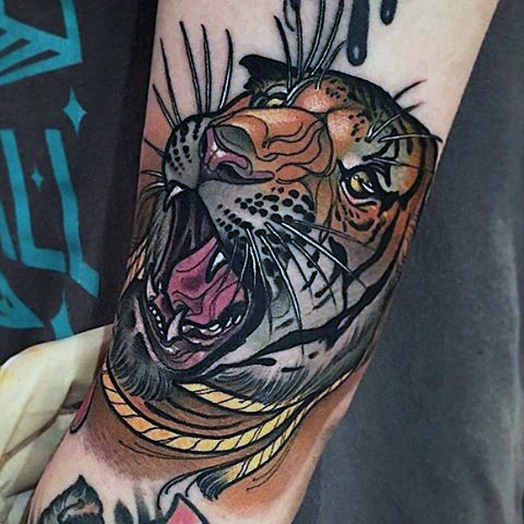 New school style colored forearm tattoo of tiger head