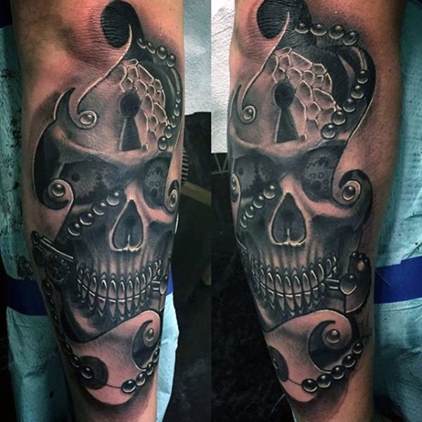 New school style colored forearm tattoo of human skull with key whole
