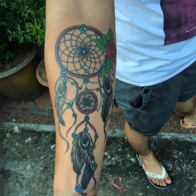 New school style colored forearm tattoo of dream catcher