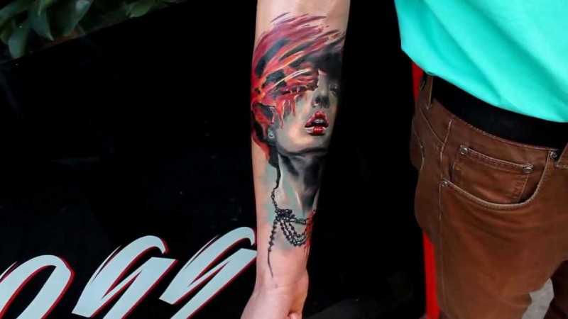 New school style colored forearm tattoo of woman with jewelry