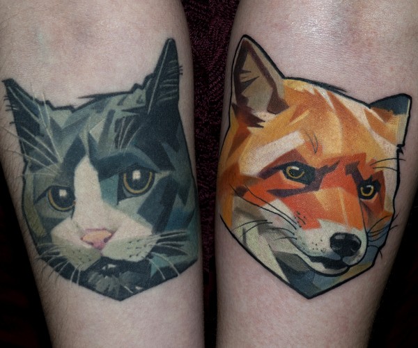New school style colored forearm tattoo of fox with cat heads