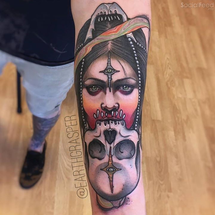 New school style colored forearm tattoo of woman with human skull