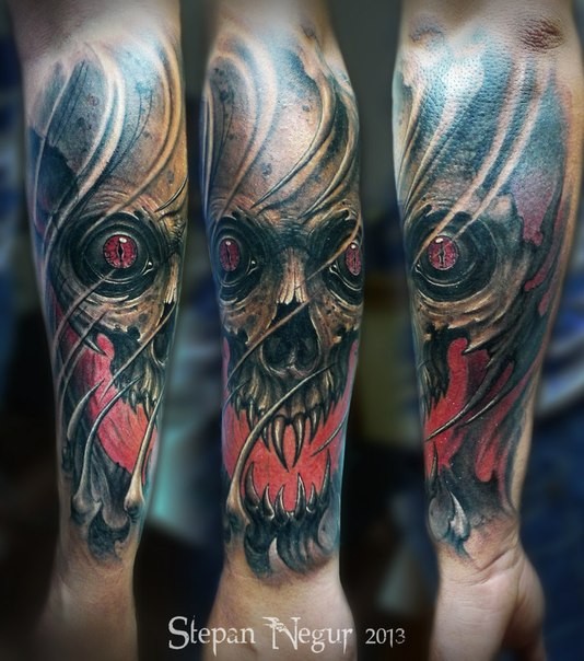 New school style colored forearm tattoo of demonic skull