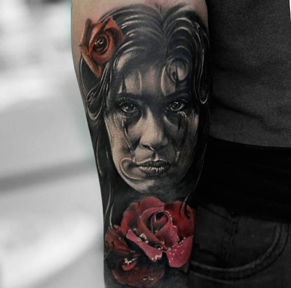 New school style colored forearm tattoo of woman with roses