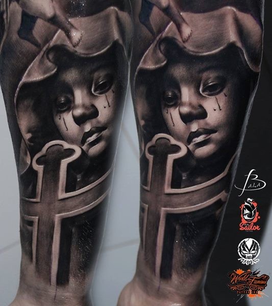 New school style colored forearm tattoo of crying girl in hood with cross