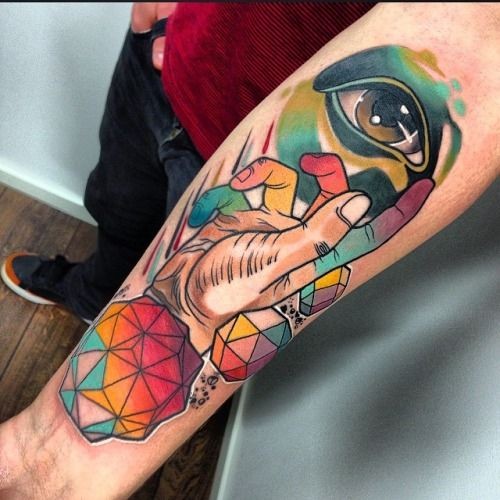 New school style colored forearm tattoo of human hand with eye