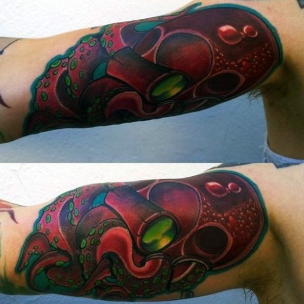 New school style colored funny looking octopus tattoo on biceps