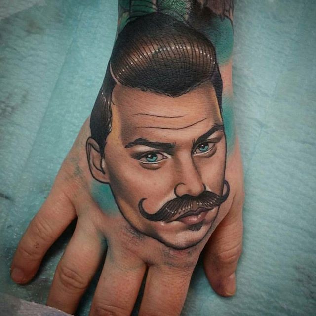 New school style colored hand tattoo od man with mustache