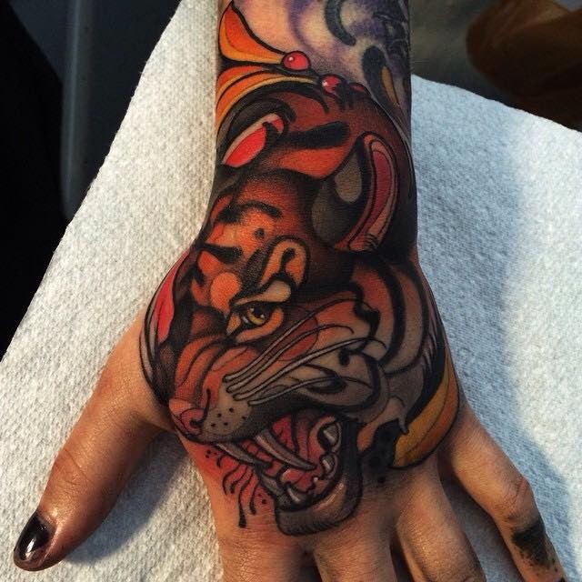 New school style colored hand tattoo of tiger head