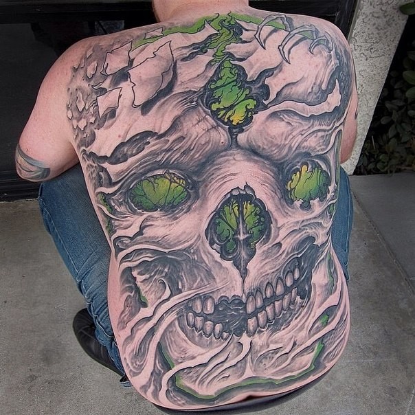 New school style colored large whole back tattoo of mystic skull with plants