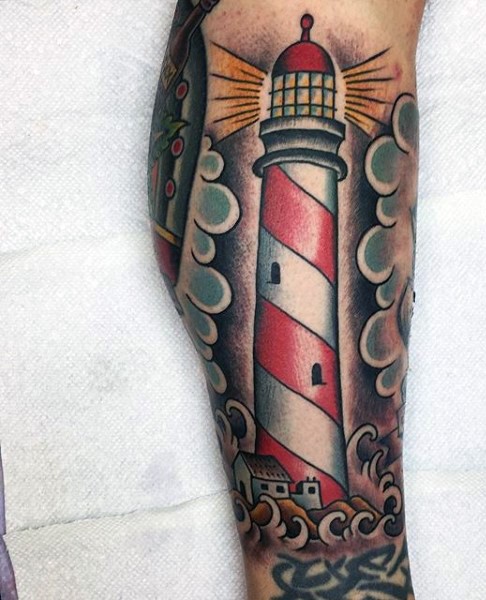 New school style colored leg tattoo of lighthouse with clouds