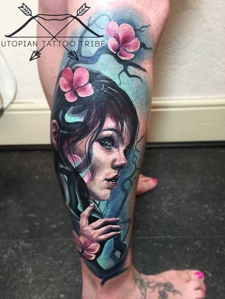 New school style colored leg tattoo of woman with blooming tree
