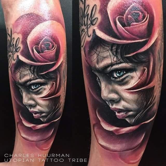 New school style colored leg tattoo of child portrait and rose