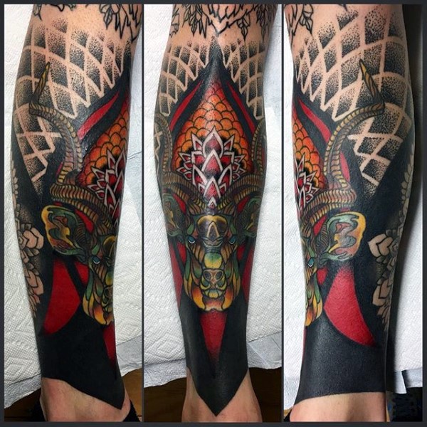 New school style colored leg tattoo of demonic goat and ornaments