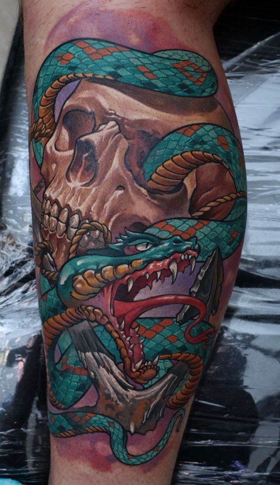 New school style colored leg tattoo of human skull with snake