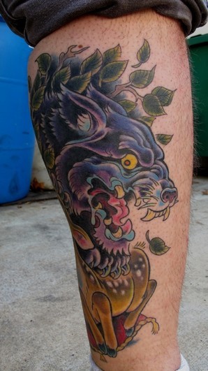 New school style colored leg tattoo of evil dog with leaves and deer