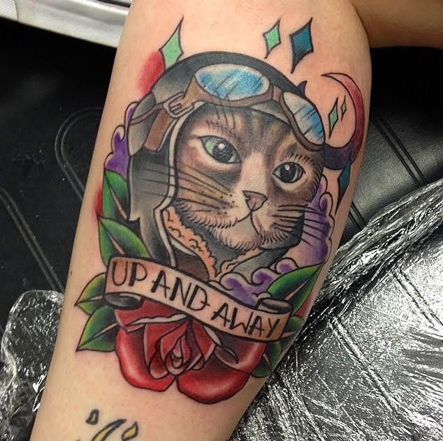 New school style colored leg tattoo of funny pilot cat with rose and lettering