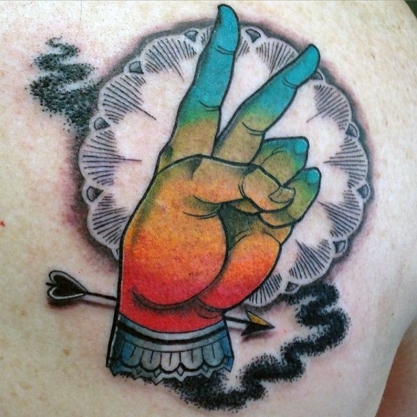 New school style colored scapular tattoo of human hand with arrow
