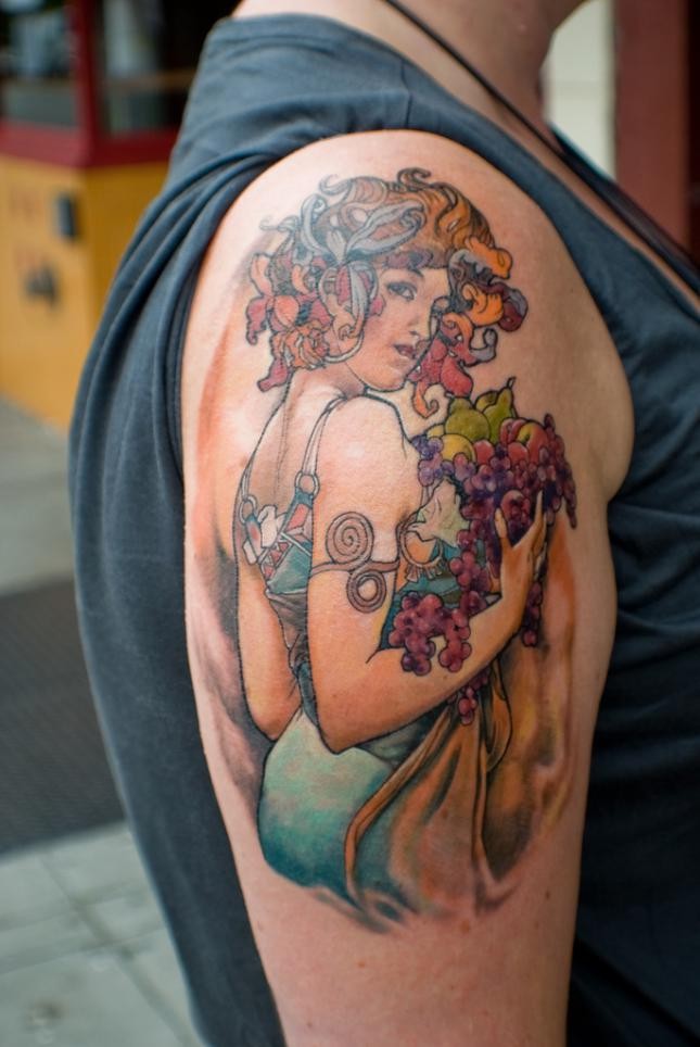 New school style colored shoulder tattoo of woman with fruits
