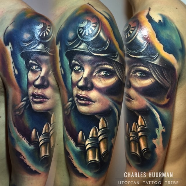 New school style colored shoulder tattoo of woman soldier with bullets
