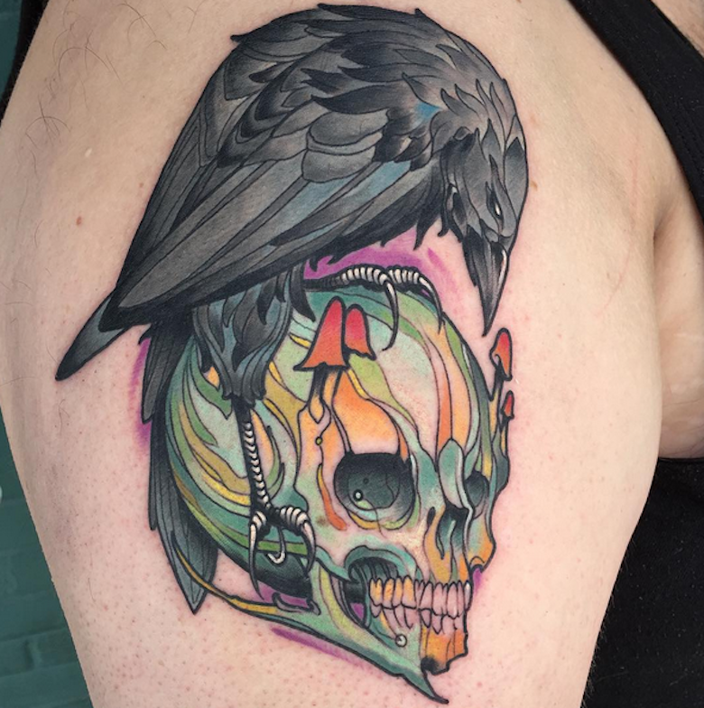 New school style colored shoulder tattoo of multicolored skull with crow
