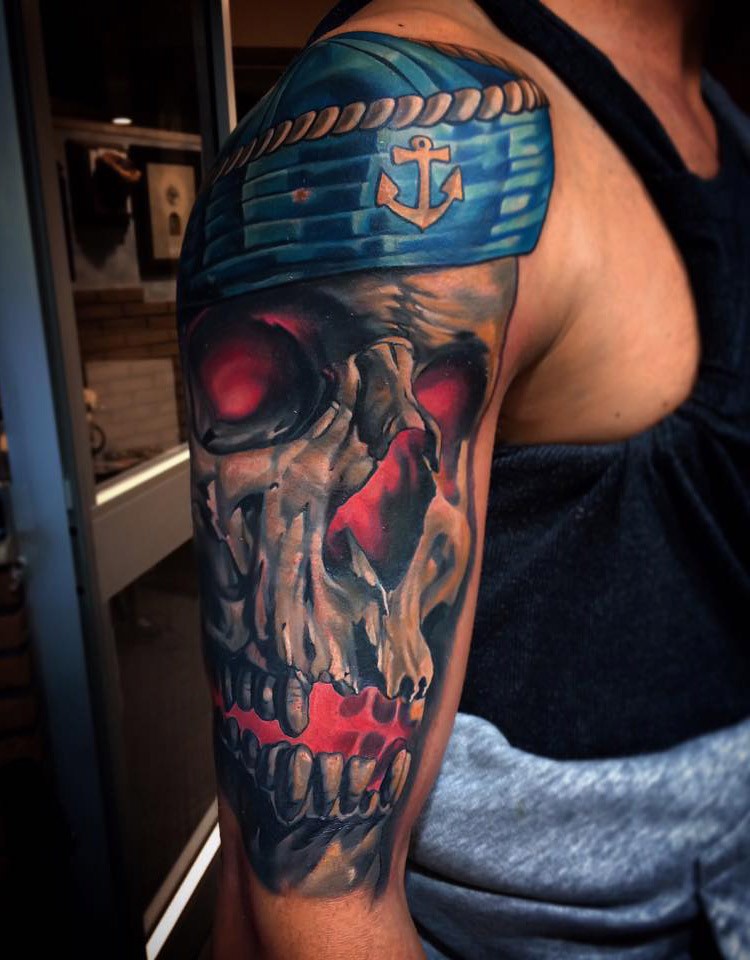 New school style colored shoulder tattoo of sailors skull with hat