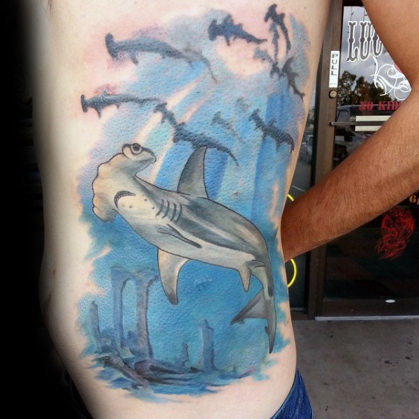 new school style colored side tattoo of hammerhead sharks with underwater ruins