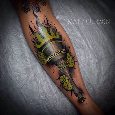 New school style colored tattoo of demonic torch with leaves