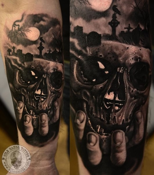 New school style colored tattoo of hand holding skull with cemetery