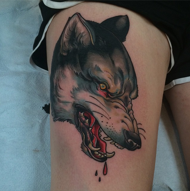 New school style colored thigh tattoo of bloody wolf head
