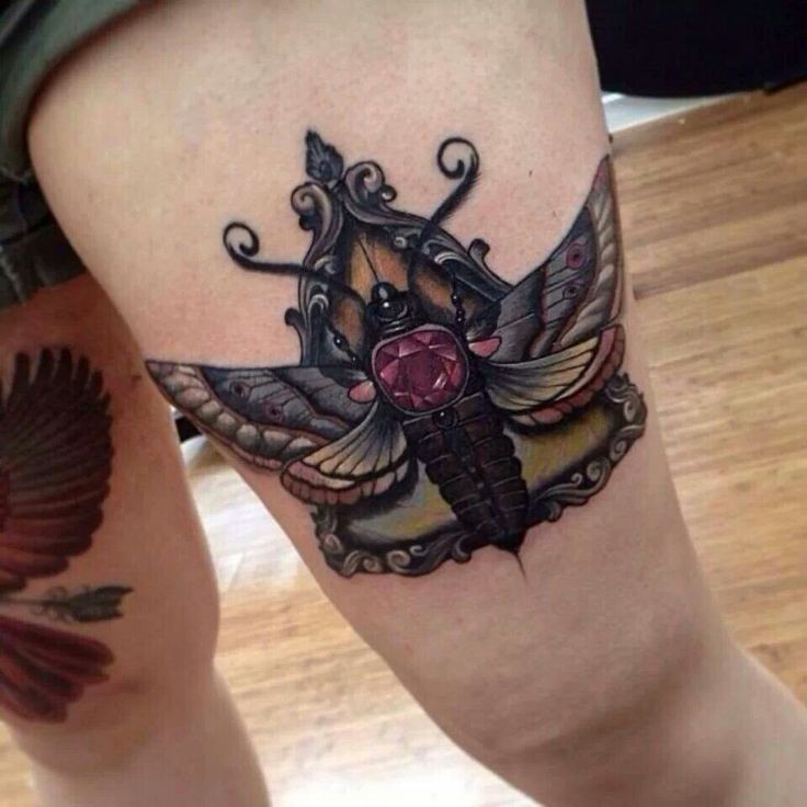 New school style colored thigh tattoo of butterfly with diamond
