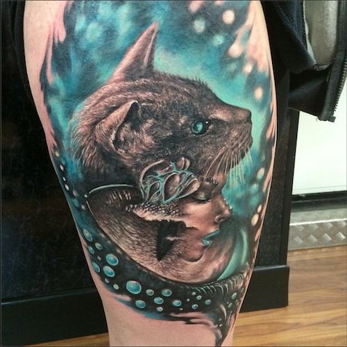 New school style colored thigh tattoo of cat head with woman