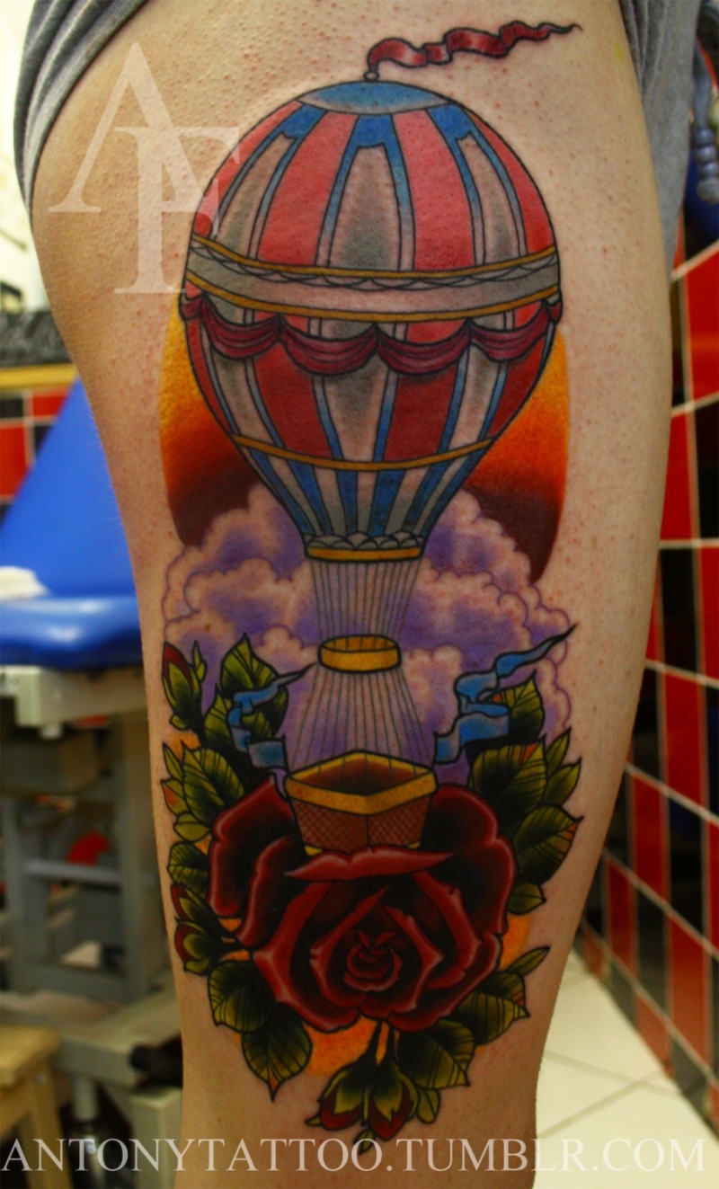 New school style colored thigh tattoo of big balloon with clouds and flowers