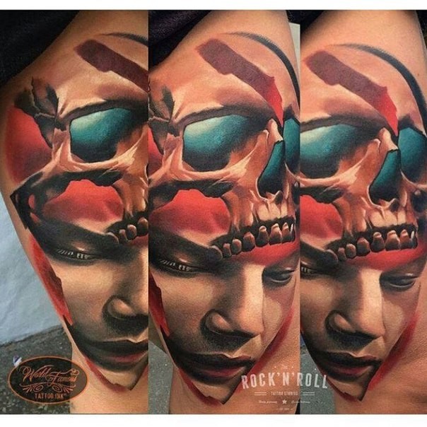 New school style colored thigh tattoo of human face with skull