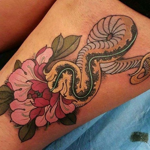 New school style colored thigh tattoo of big snake with flowers