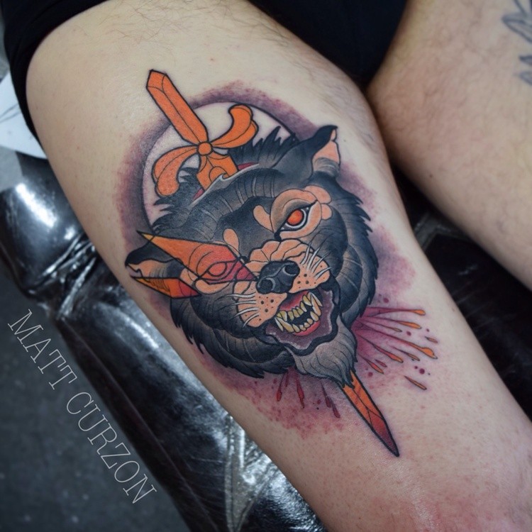New school style colored thigh tattoo of bloody wolf head with sword