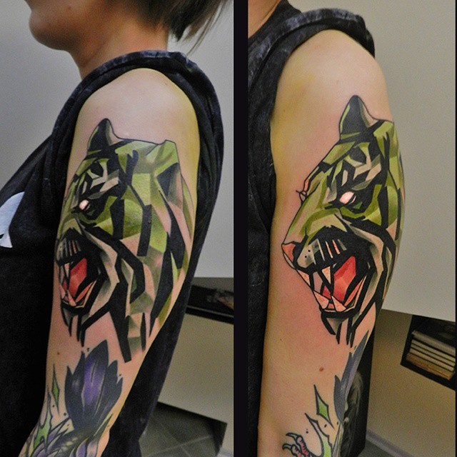 New school style colored upper arm tattoo of roaring tiger