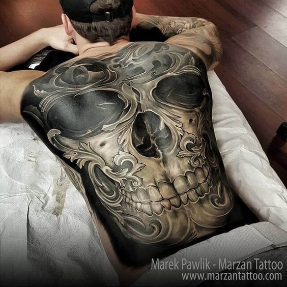 New school style colored whole back tattoo of human skull with ornaments