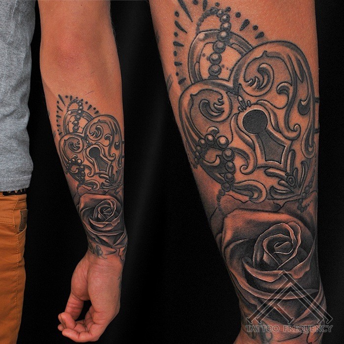 New school style detailed arm tattoo of beautiful lock with rose