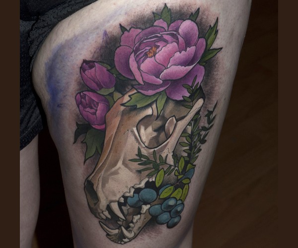New school style thigh tattoo of animal skull with flowers