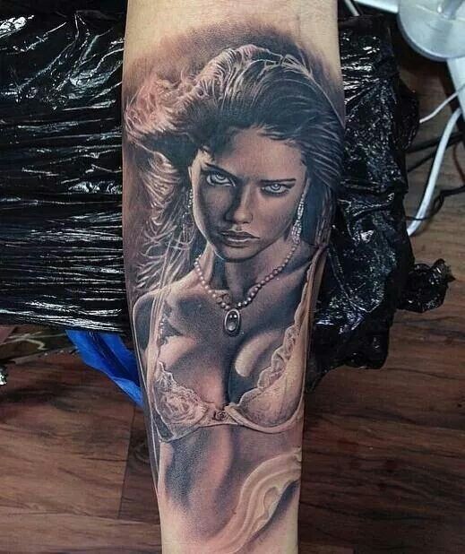 New school style very detailed forearm tattoo of sexy woman face