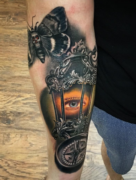 New school style very detailed forearm tattoo of old lighter with eye and butterfly